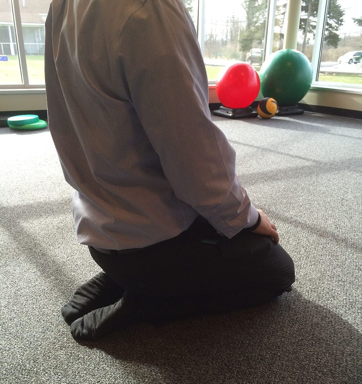 Person kneeling on the floor